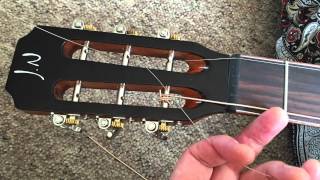 Restringing a slotted headstock guitar [upl. by Nuawtna427]