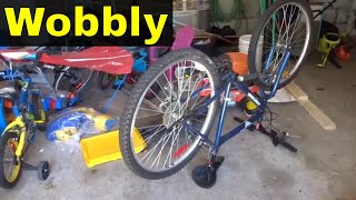 How To Straighten A Wobbly Bicycle WheelTutorial [upl. by Arymas]